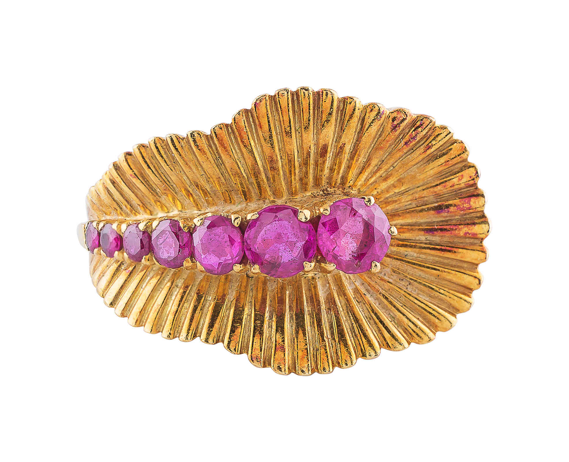 A ring with pink stones, possibly tourmaline, set in yellow gold