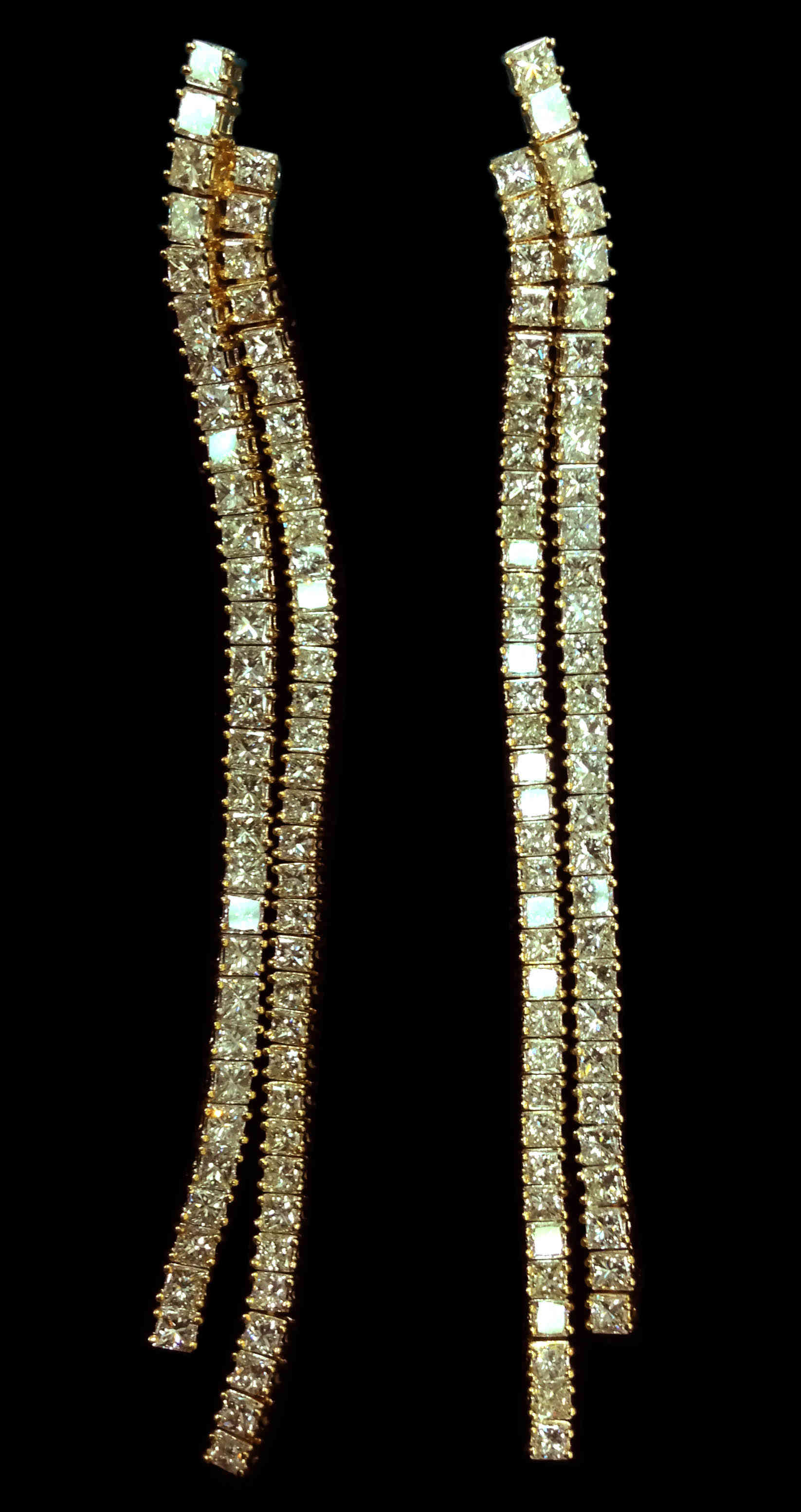 A pair of straightline diamond earrings