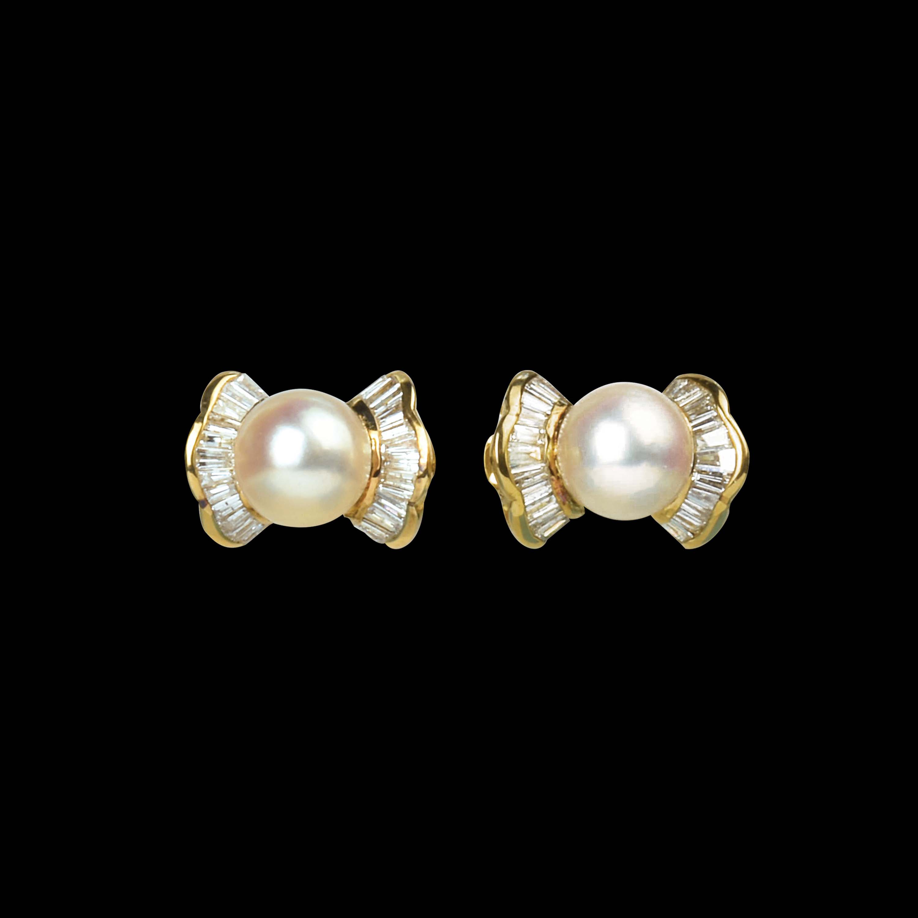 a-pair-of-diamond-and-7-mm-pearl-earrings-set-in-14k-yellow-gold