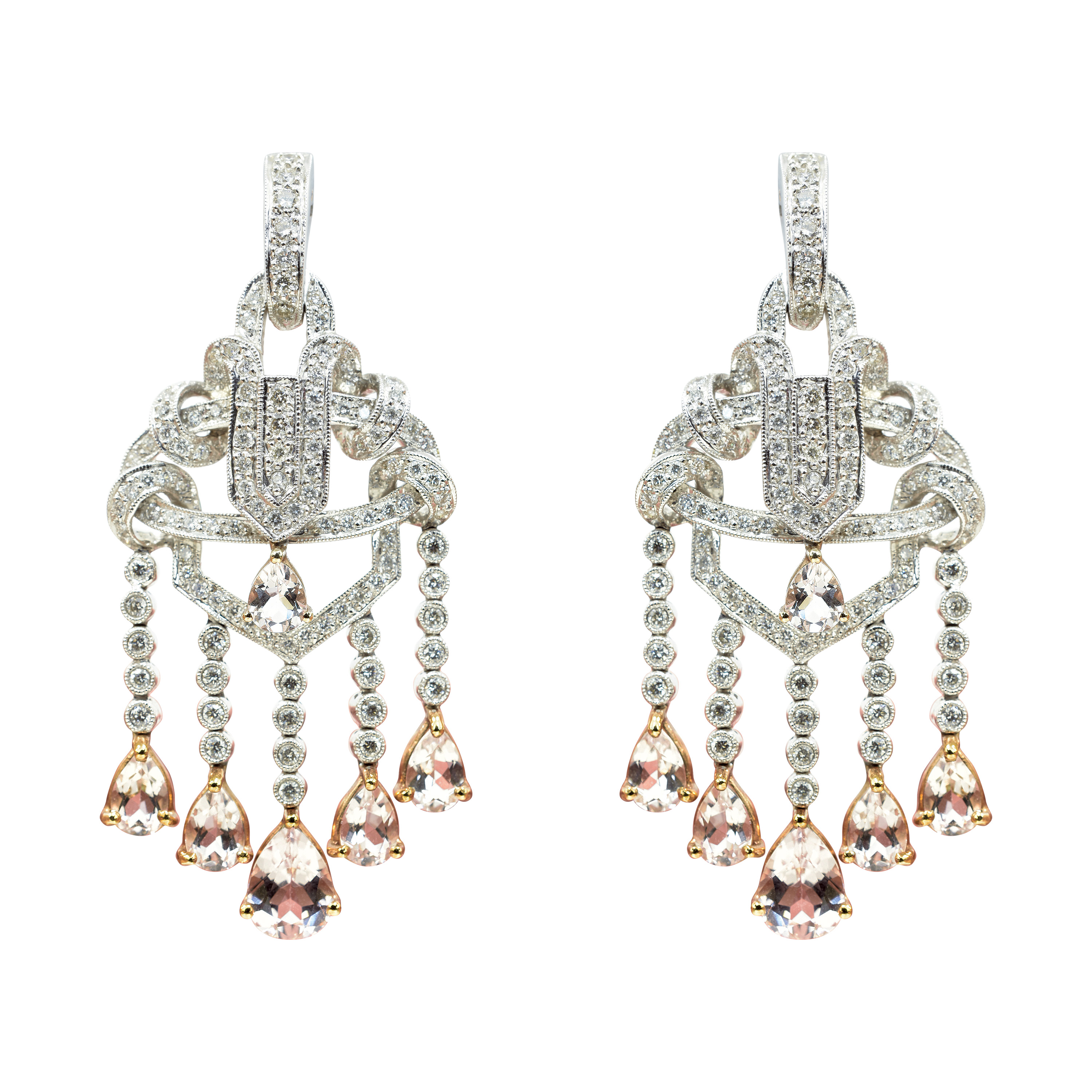 - A pair of diamond dangling earrings set in white gold