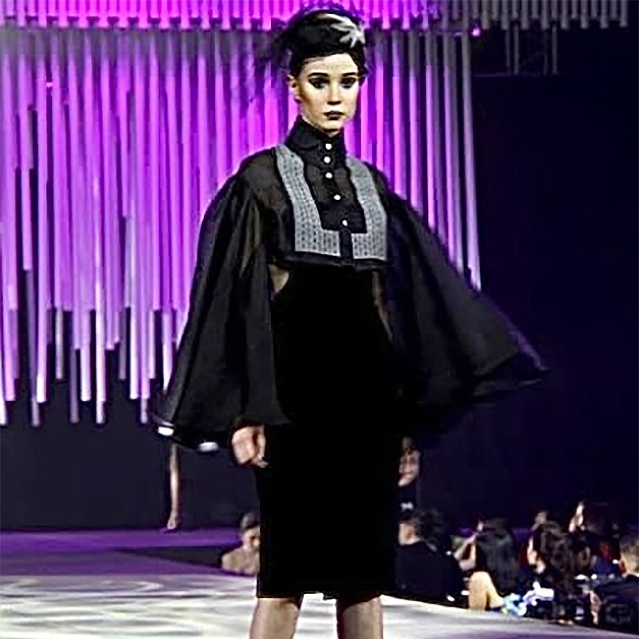 Jojie Lloren - A cropped black pina barong with cape sleeves, over ...