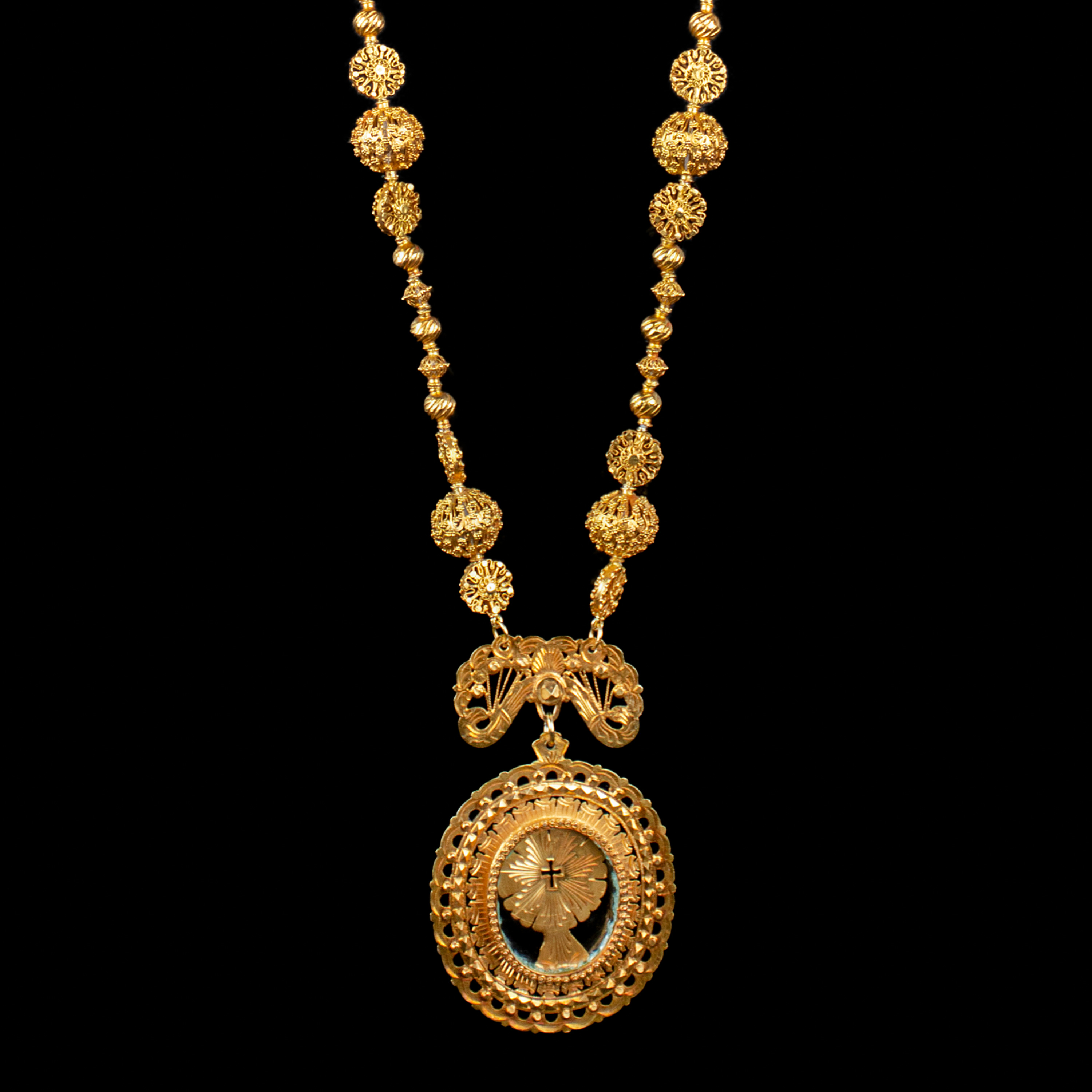 A vintage 12k gold tambourine necklace