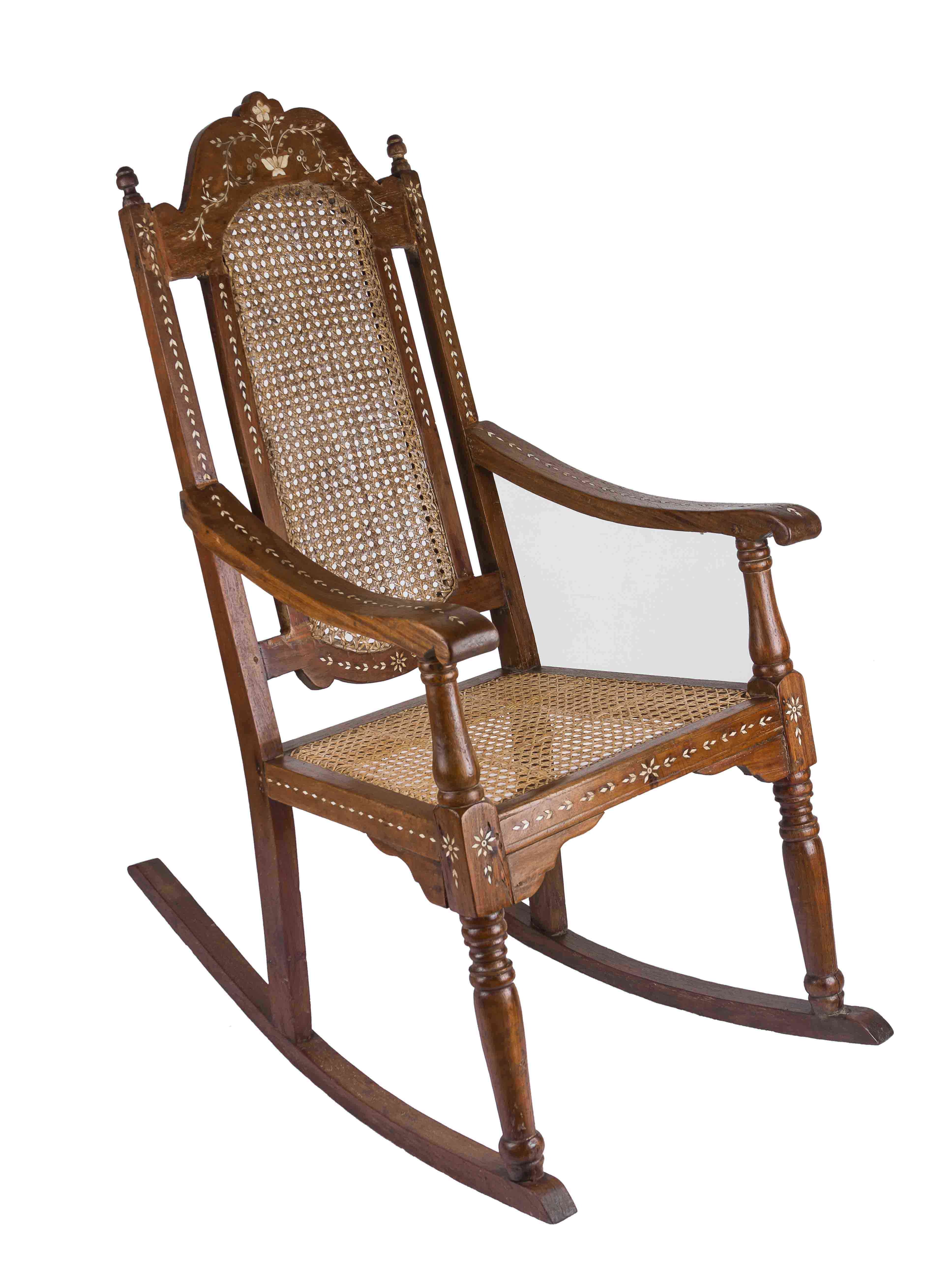 An antique rocking chair with bone inlay