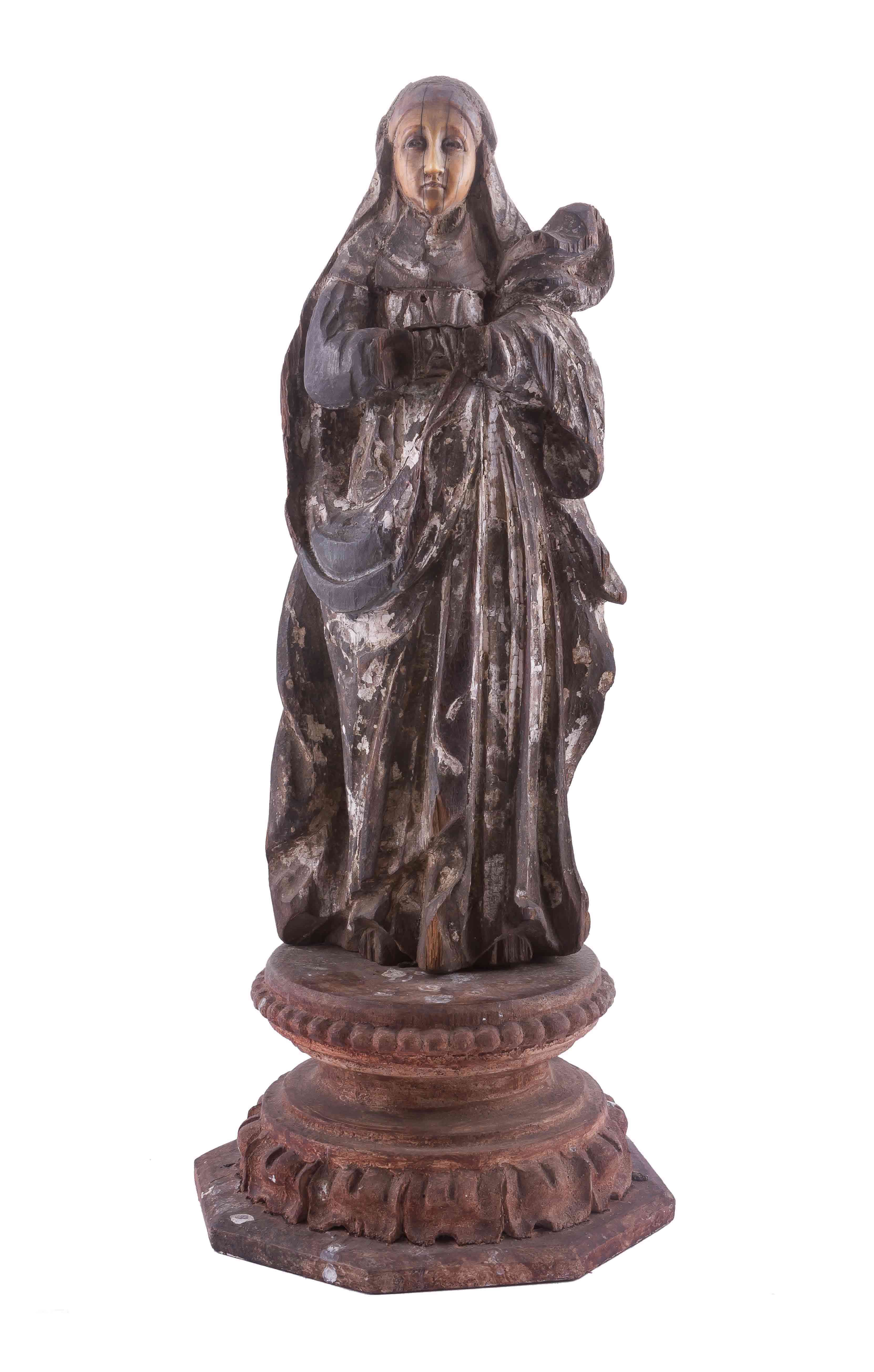 A figurine of Mother Dolorosa with an ivory face