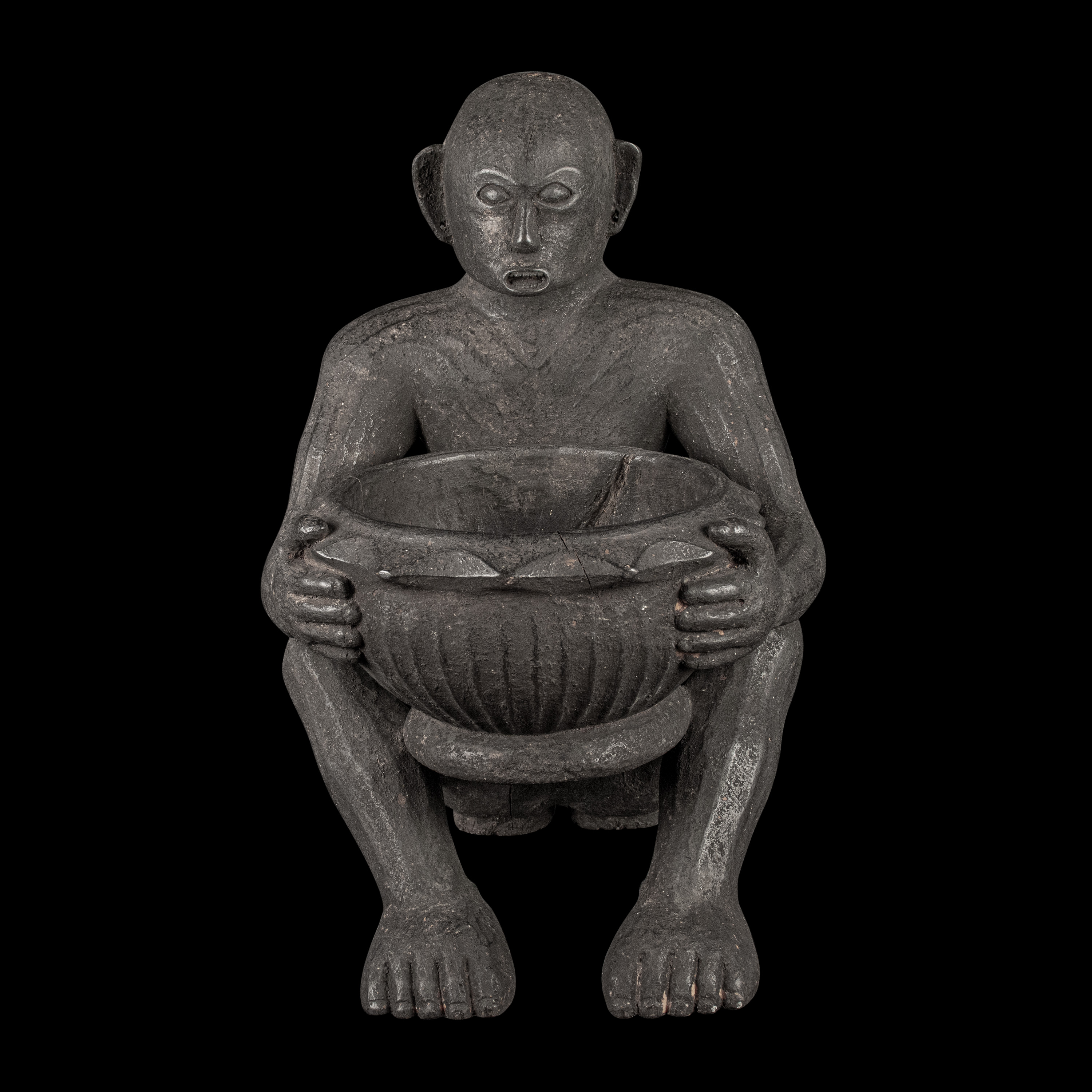 - A seated Bul'ul figure with wine bowl