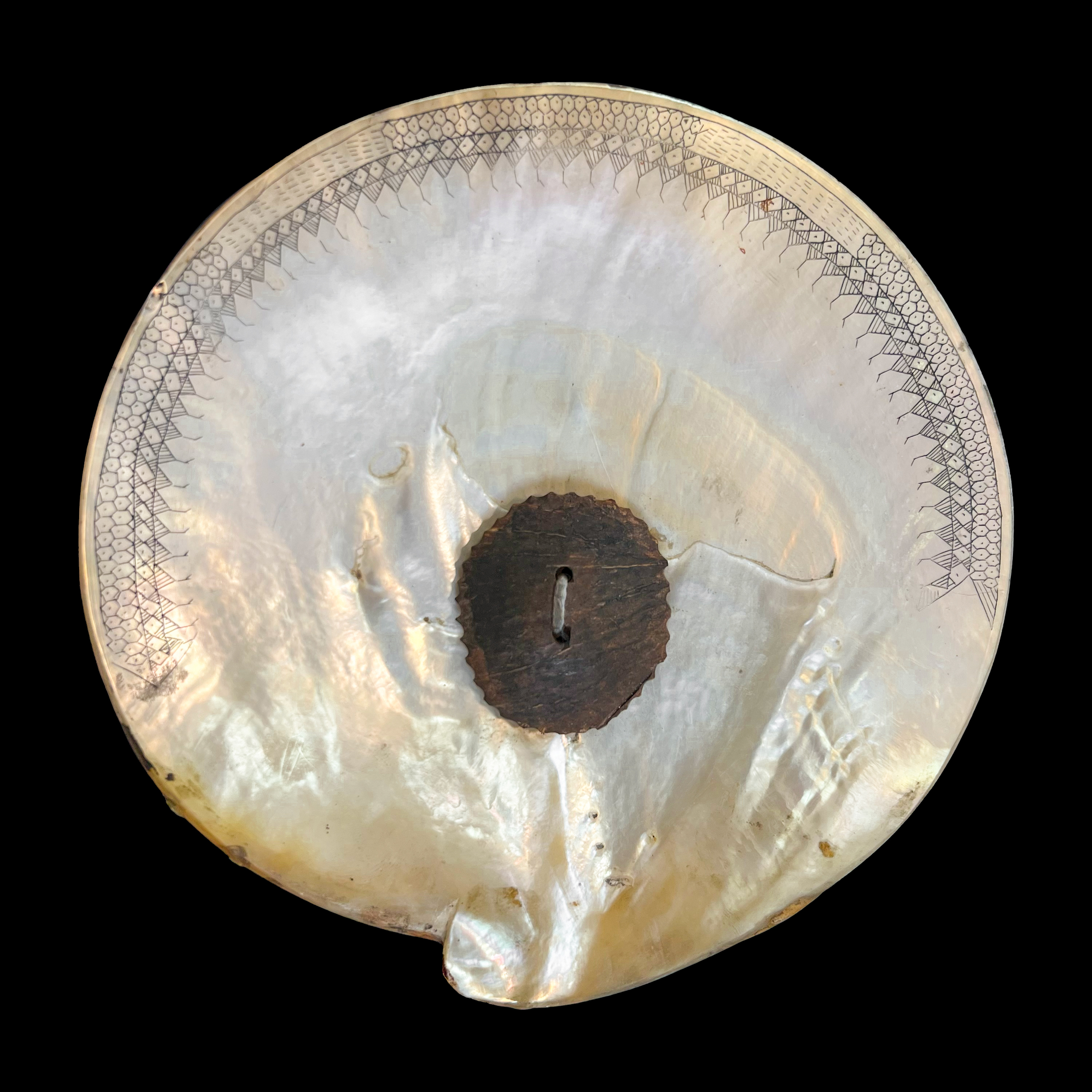 - A Fikum mother-of-pearl decorated around the edge with incised ...
