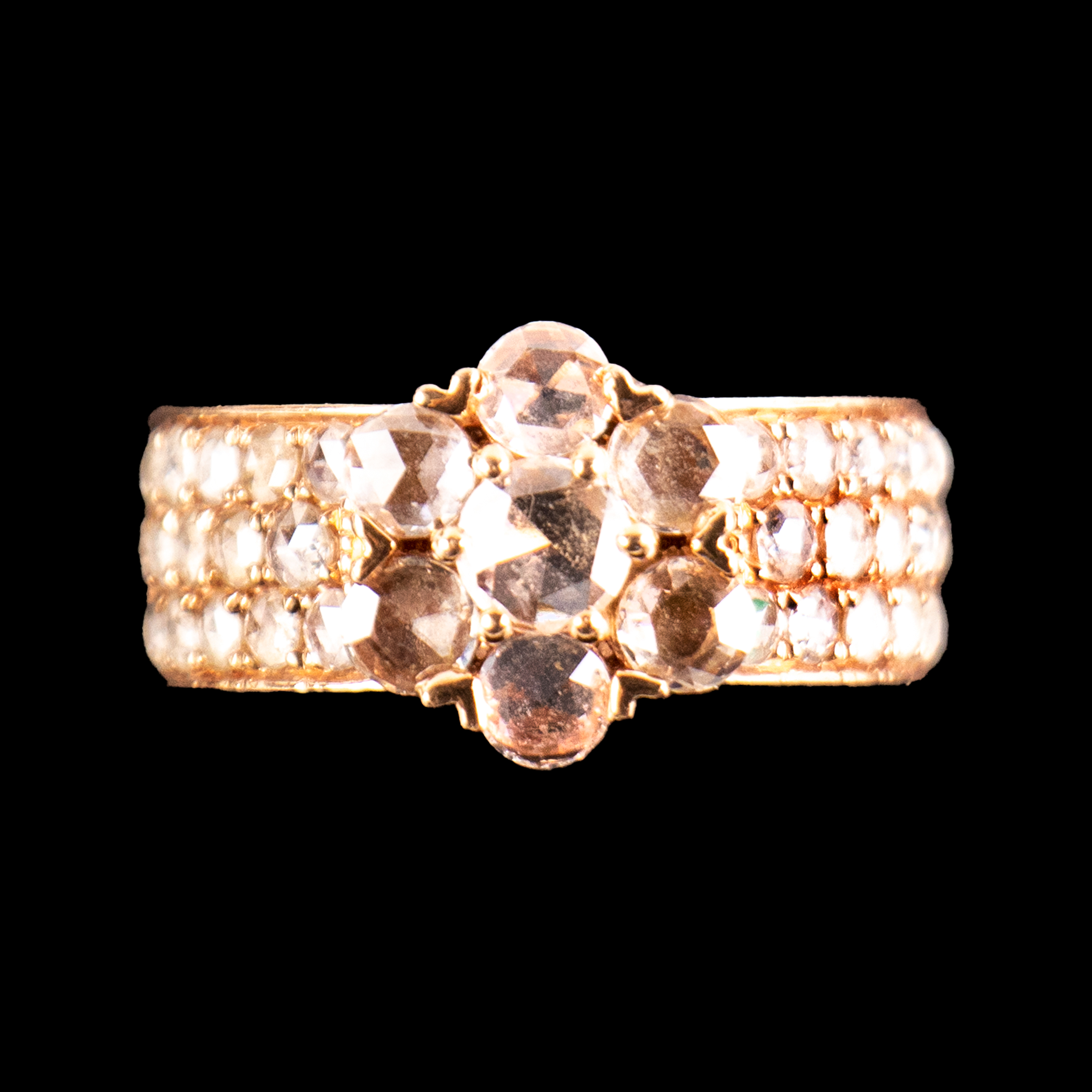 - A flower cluster diamond ring set in 18k rose gold