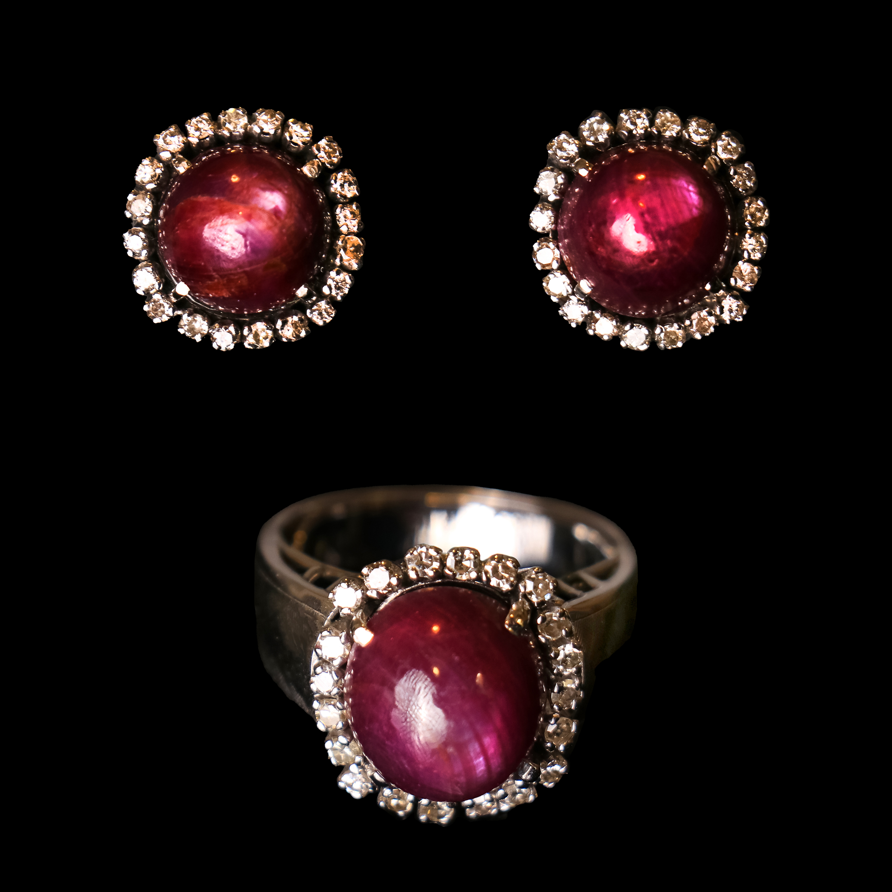 - A diamond and ruby ring and earring set in 14k white gold