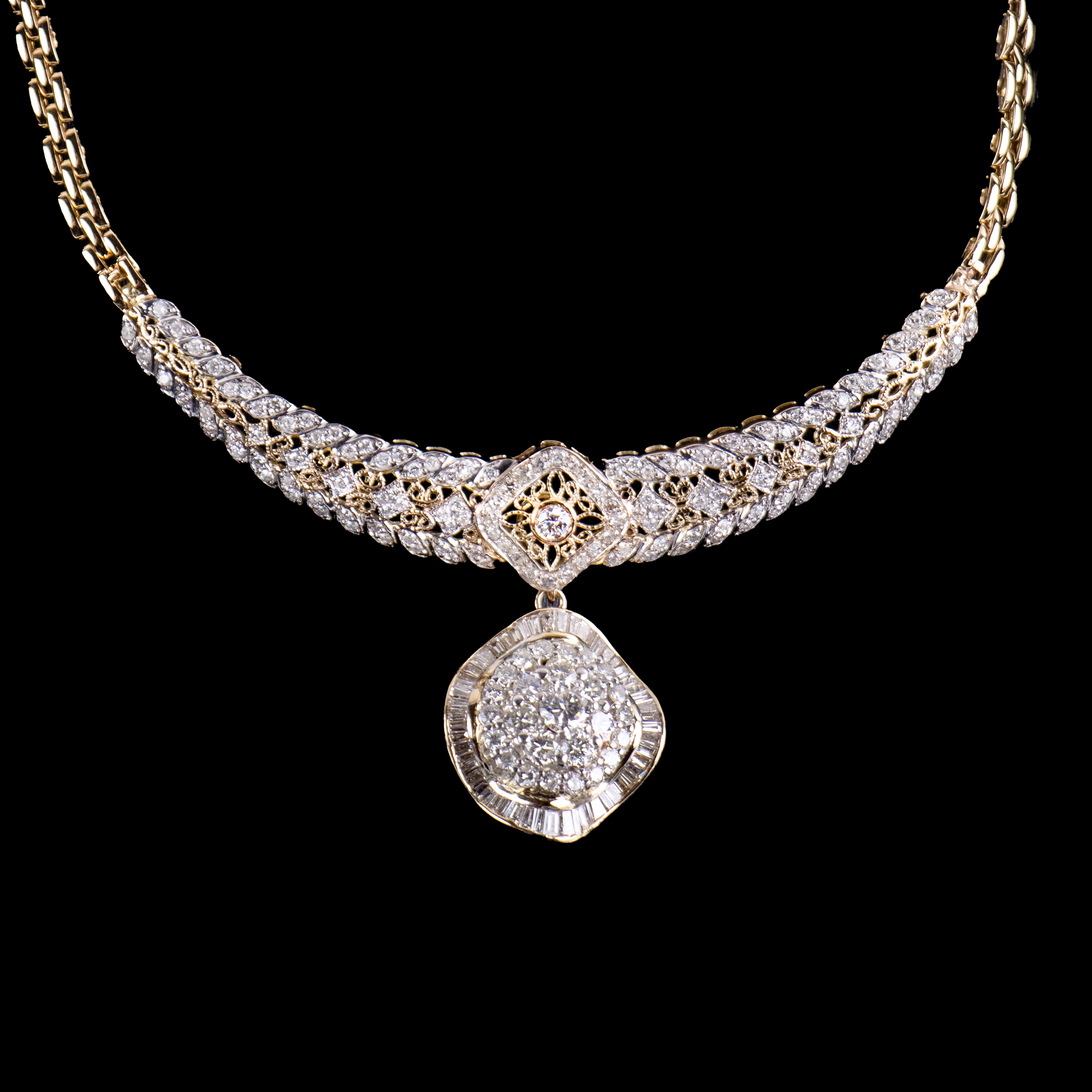 - A diamond necklace with detachable pendant